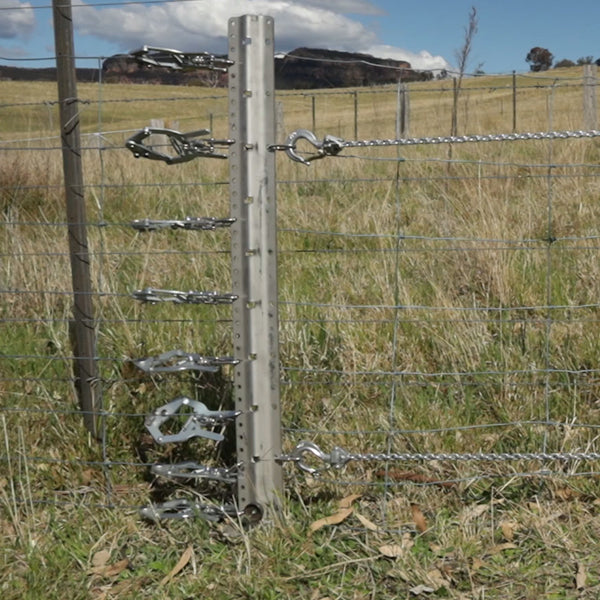 exclusion fence strainer and tensioner board on fence
